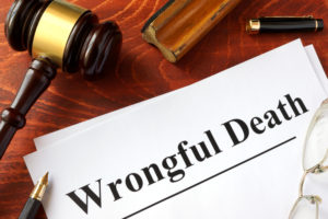 Document titled "wrongful death law" with gavel next to it